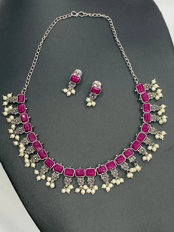 Black Pearl Necklace-Dazzling Rectangle Pink Stone Studded Flower Designed Silver Toned Oxidized Necklace Set With Earrings